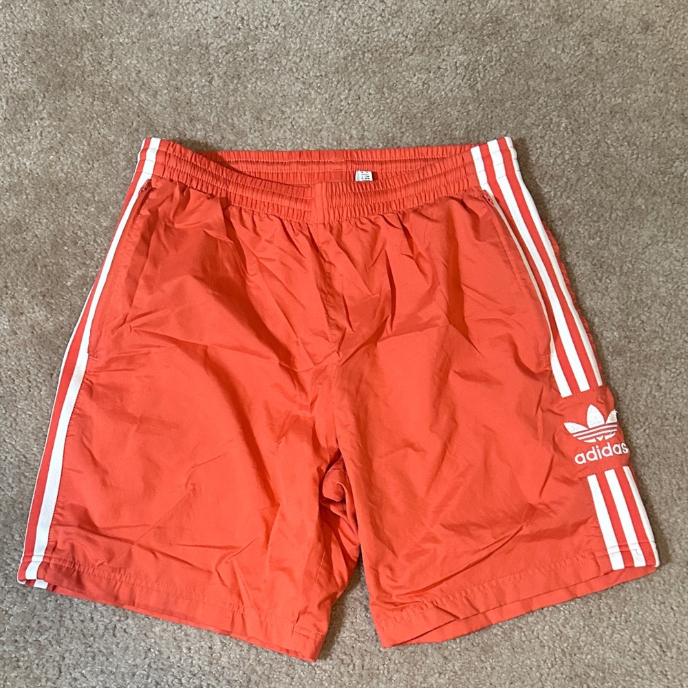 Adidas Orange Shorts with White Stripes